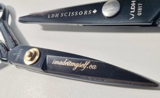 Two pairs of midnight black LDH scissors. One pair shows engraved letter with imadeitmyself.ca